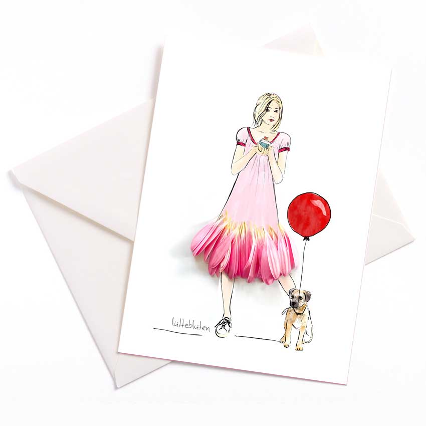 Grußkarte von Lütteblüten: Illustration einer Frau im pinken Blumenkleid mit Hund und rotem Ballon. Liebevoll gestaltete Karte mit echten Blütenelementen – ideal zum Geburtstag.